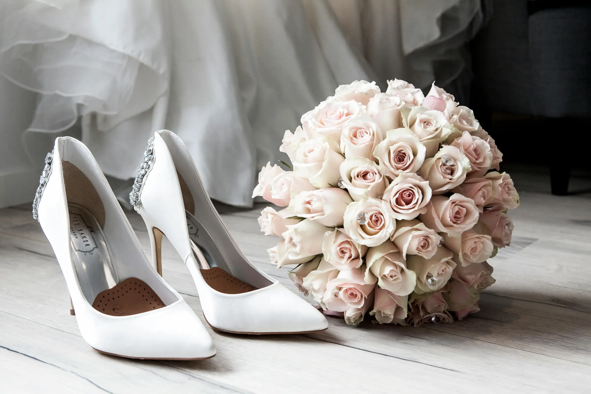 Wedding shoes and a bouquet of roses
